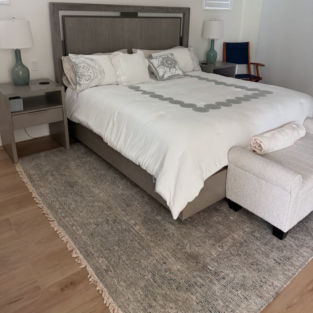 Neatly prepared bedroom after residential cleaning